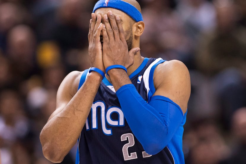 Dallas Mavericks forward Vince Carter reacts while playing against the Toronto Raptors...