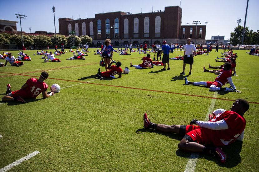 The SMU football team stretches before practice on Thursday, August 4, 2016 at the Pettus...