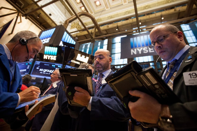 Traders work on the floor of the New York Stock Exchange (NYSE) in New York, U.S., on...