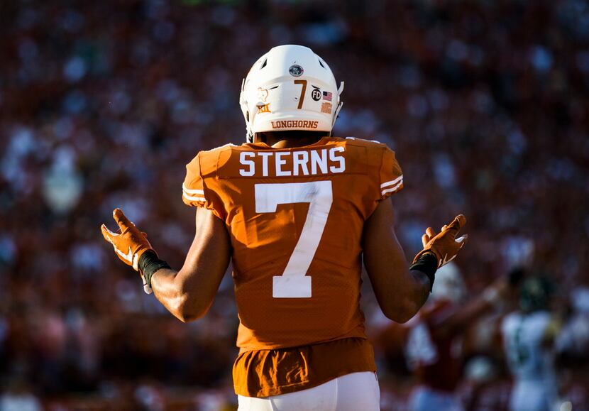 FILE - Texas defensive back Caden Sterns (7) signals to fans to cheer during the fourth...