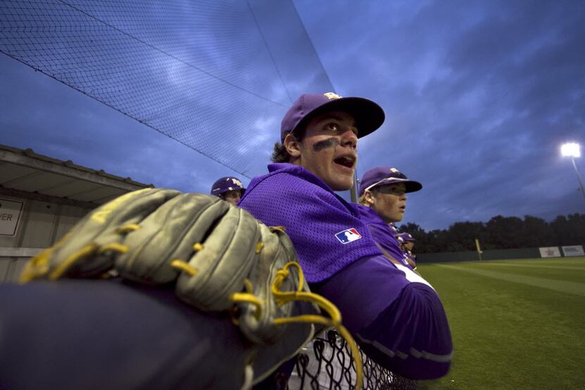 Richardson Eagles players Esteban Cardoza (12) and Caleb Combs (11) voice their support from...