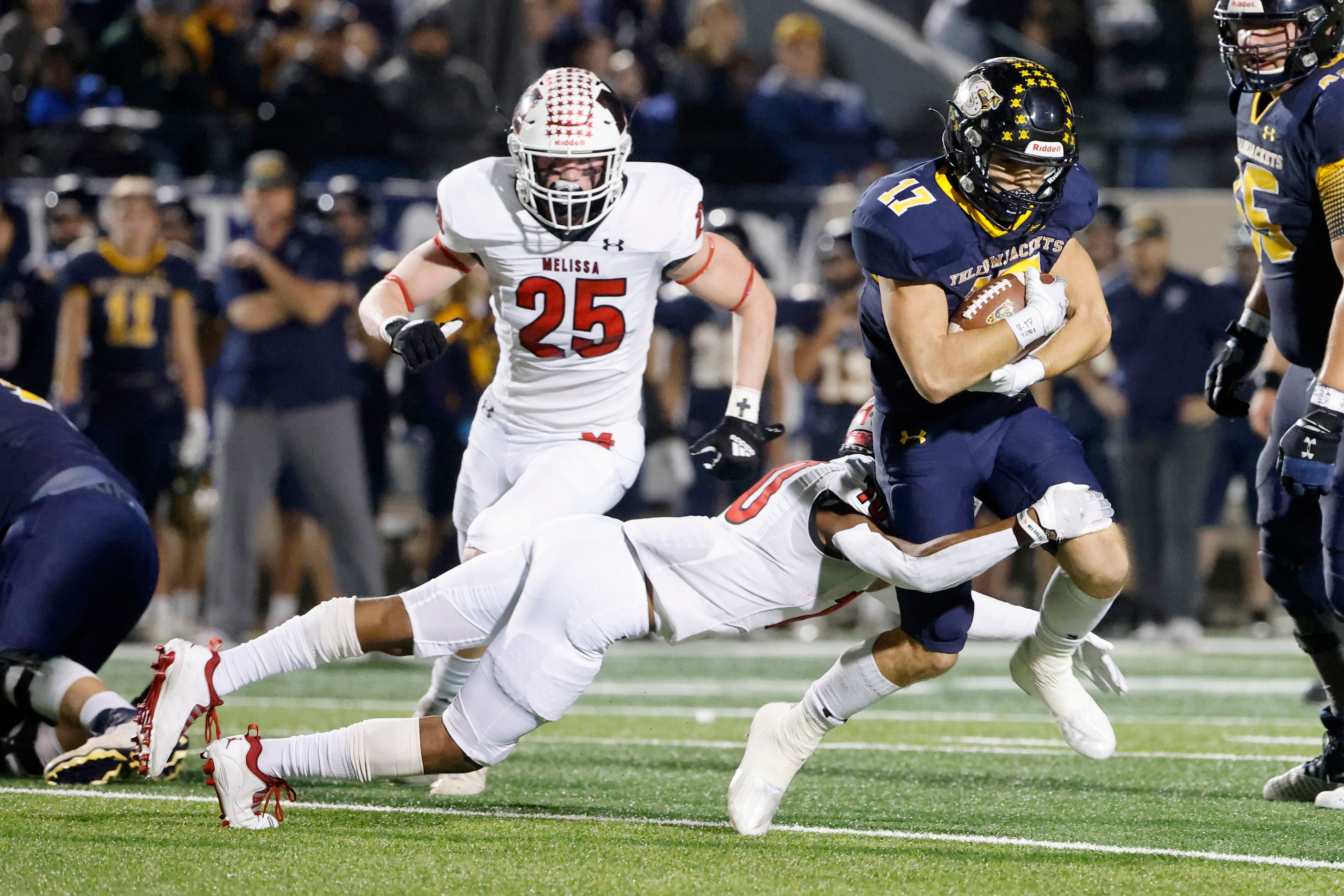 Melissa’s Parrish Adger (10) tackles Stephenville wide receiver Tate Maruska (17) during the...