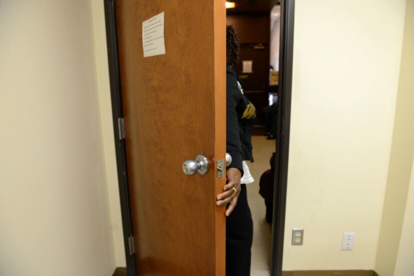 Client Margie Jackson leaves the room after being interview to receive aid from Oak Cliff...