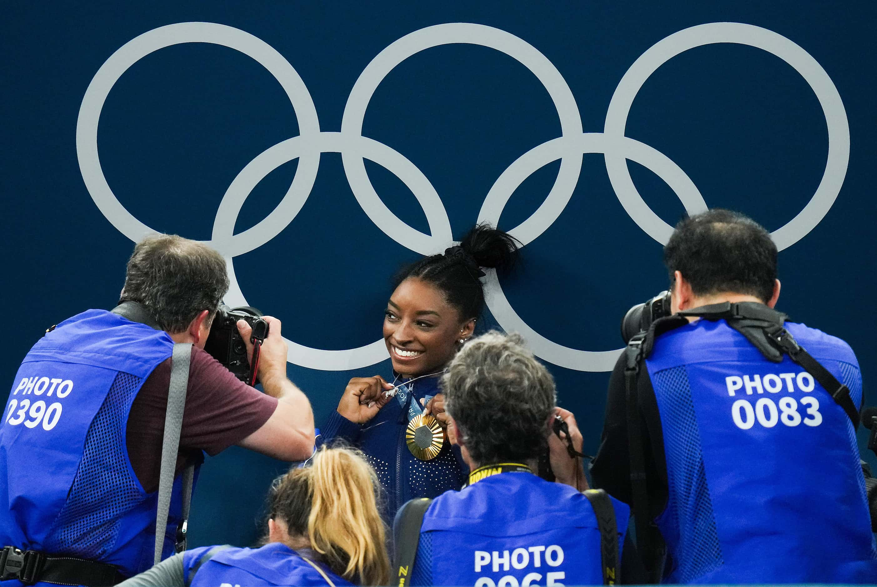 Gold medalist Simone Biles of the United States poses with her medal after winning the...