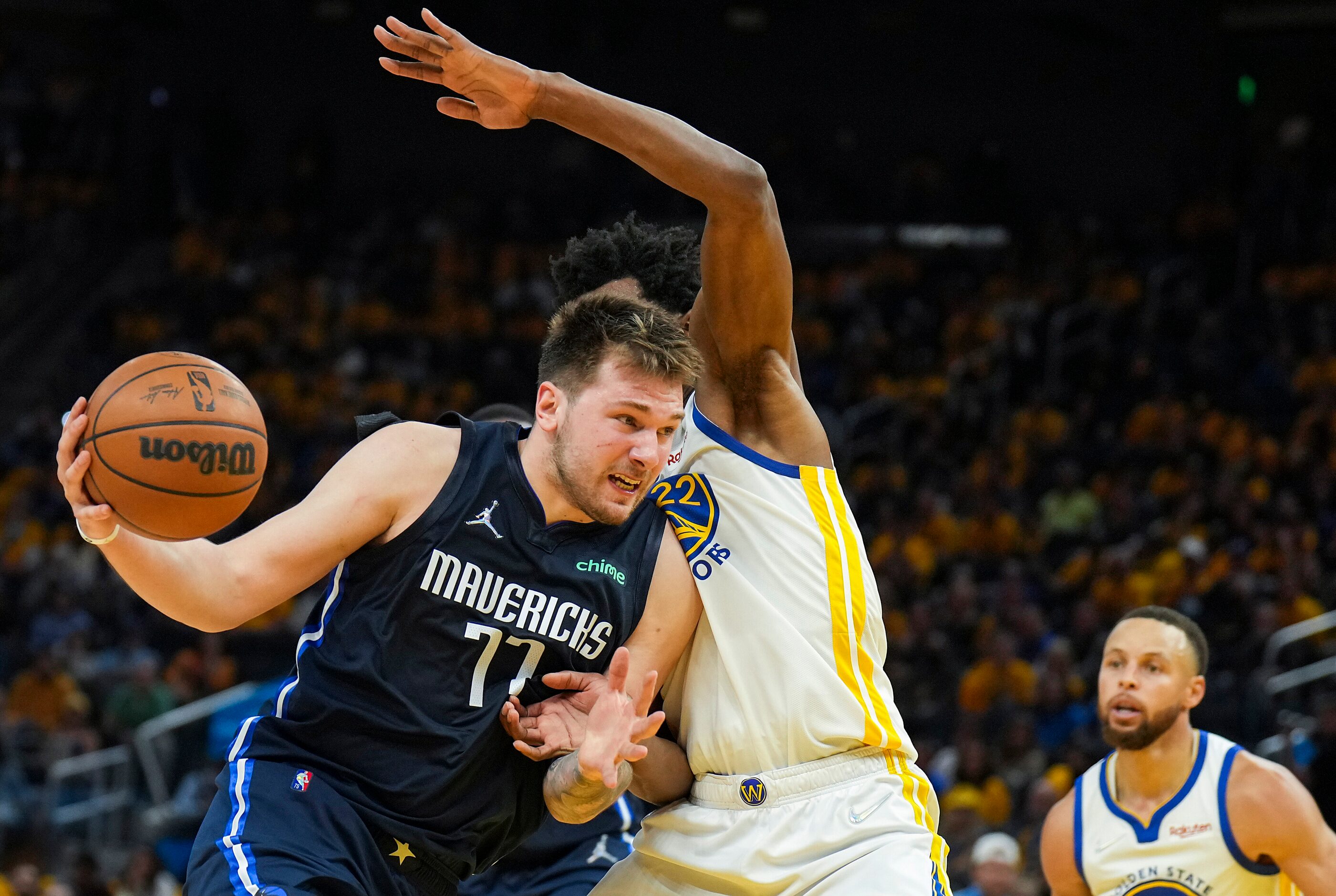 Dallas Mavericks guard Luka Doncic (77) drives against Golden State Warriors forward Andrew...