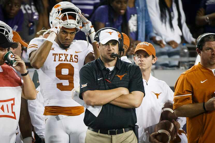 Texas head coach Tom Herman watches from the sideline during the second half of an NCAA...