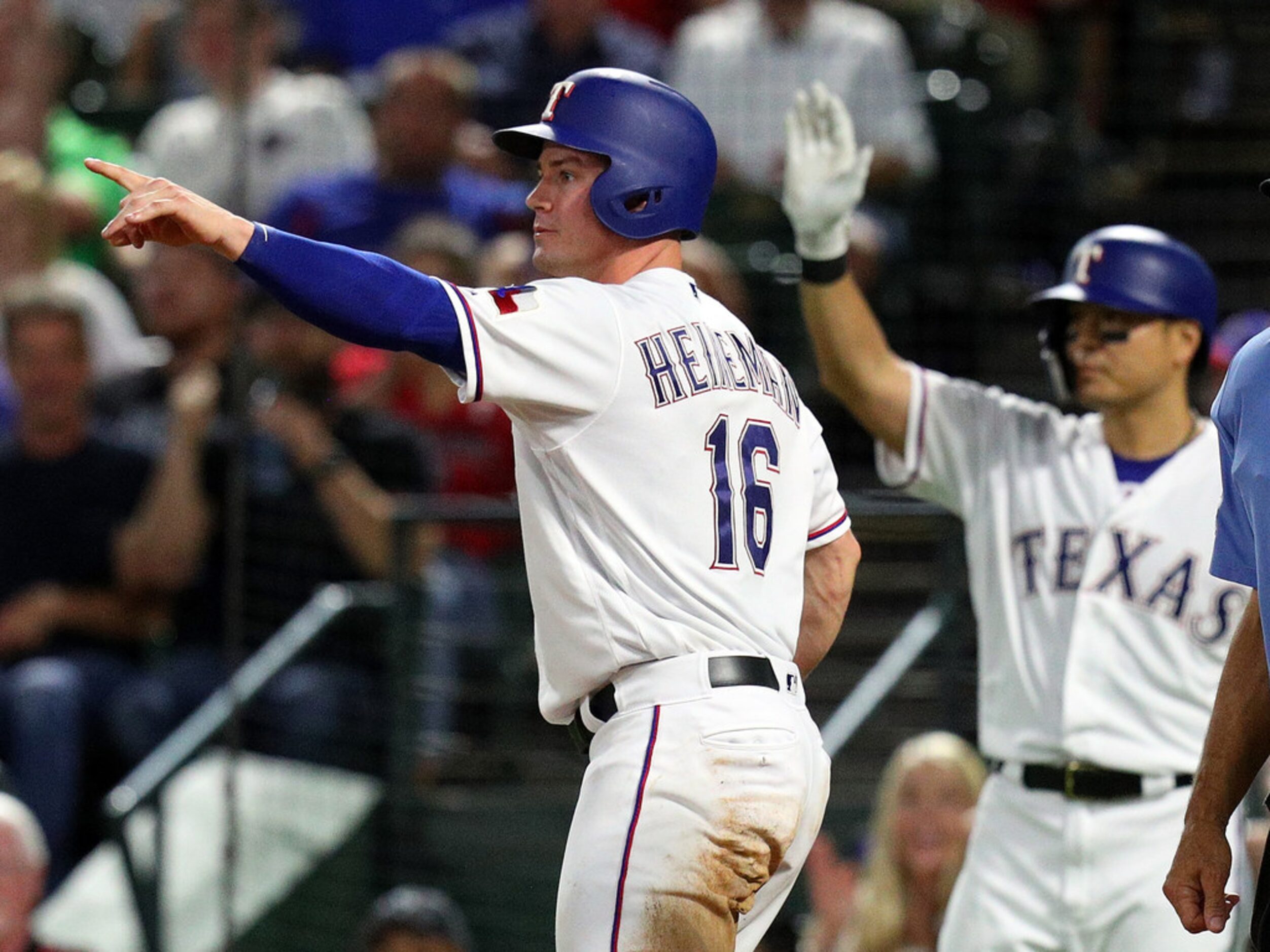 ARLINGTON, TEXAS - AUGUST 30: Scott Heineman #16 of the Texas Rangers gestures to second...