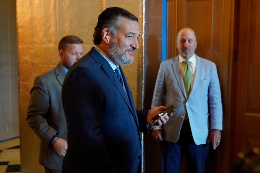 Sen. Ted Cruz, R-Texas, steps out of the Senate Chamber on Capitol Hill in Washington,...
