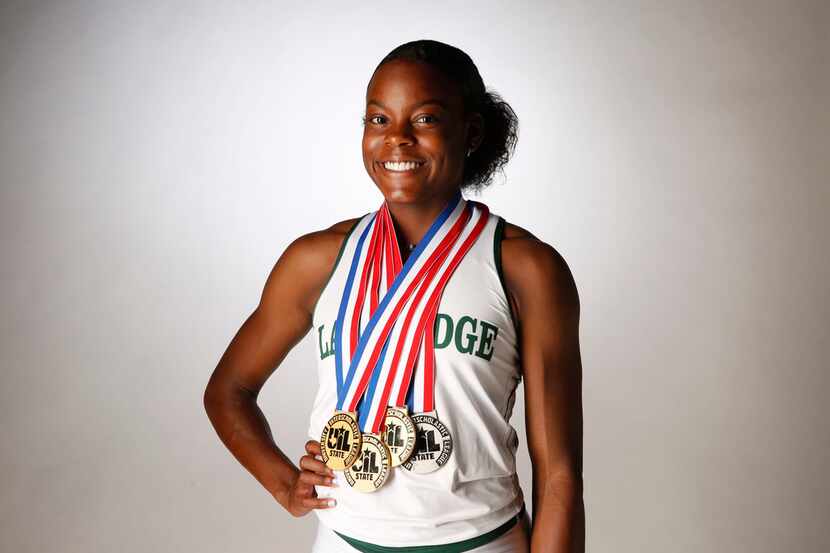 Mansfield Lake Ridge's Jasmine Moore poses for pictures at The Dallas Morning News photo...