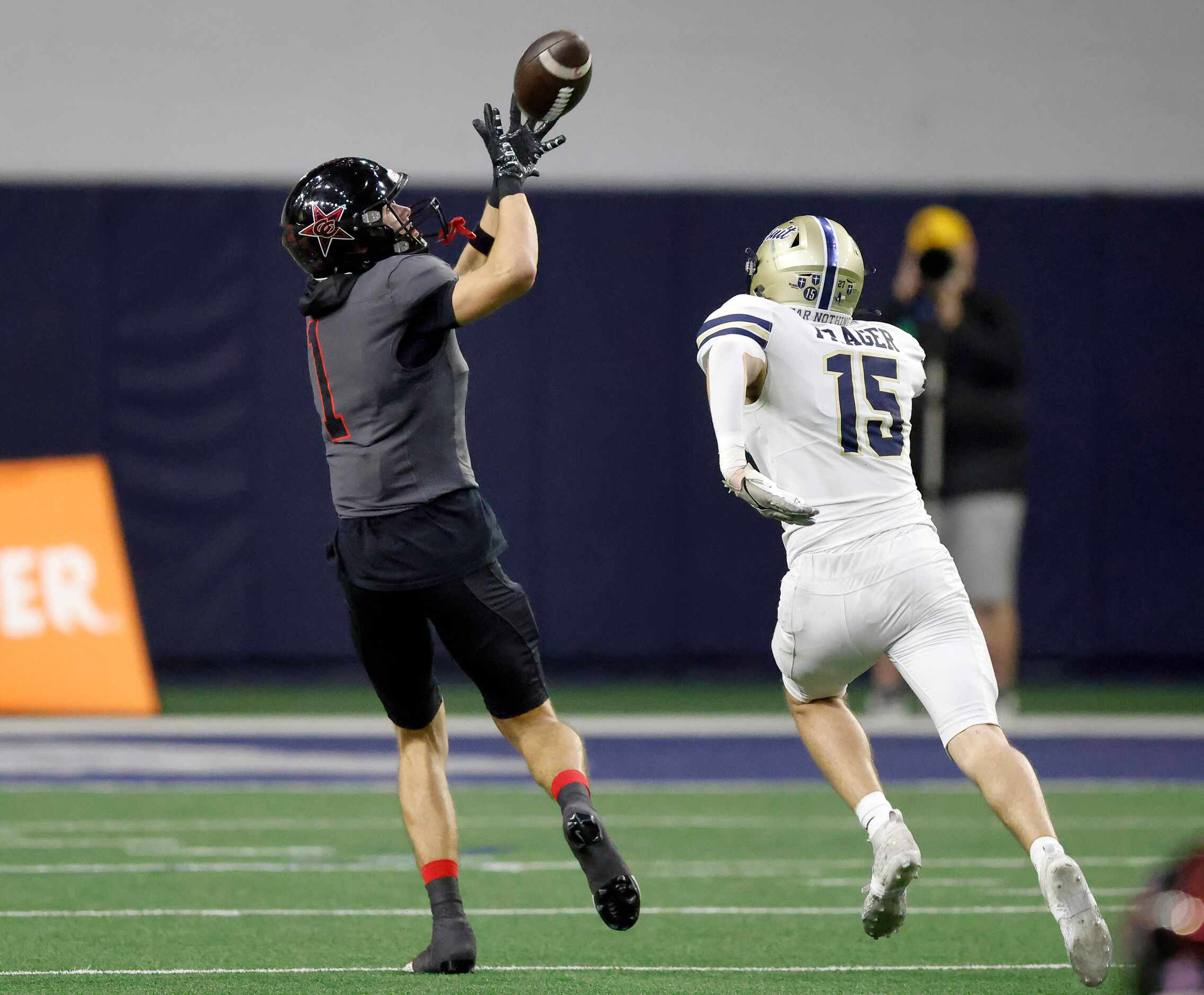Coppell wide receiver Baron Tipton (1) pulls in a long touchdown pass in front of Jesuit...