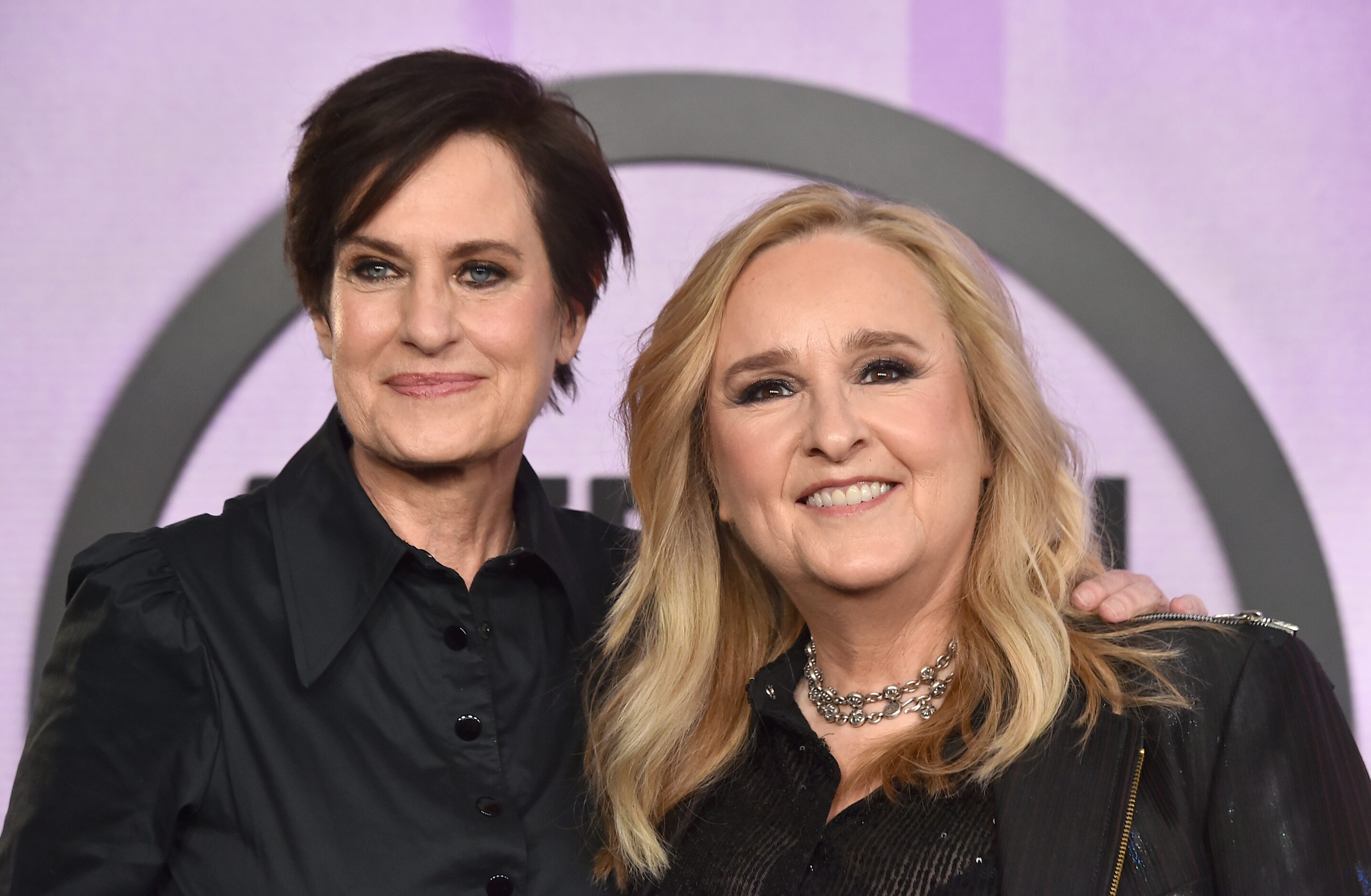 Melissa Etheridge, right, and Linda Wallem arrive at the American Music Awards on Sunday,...