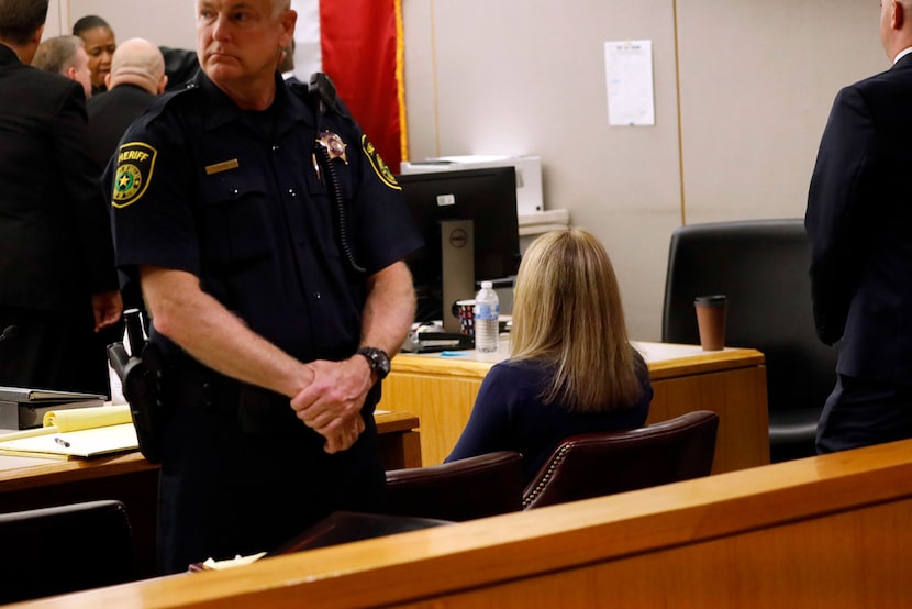 Fired Dallas police Officer Amber Guyger sits alone after being found guilty of murder Tuesday.