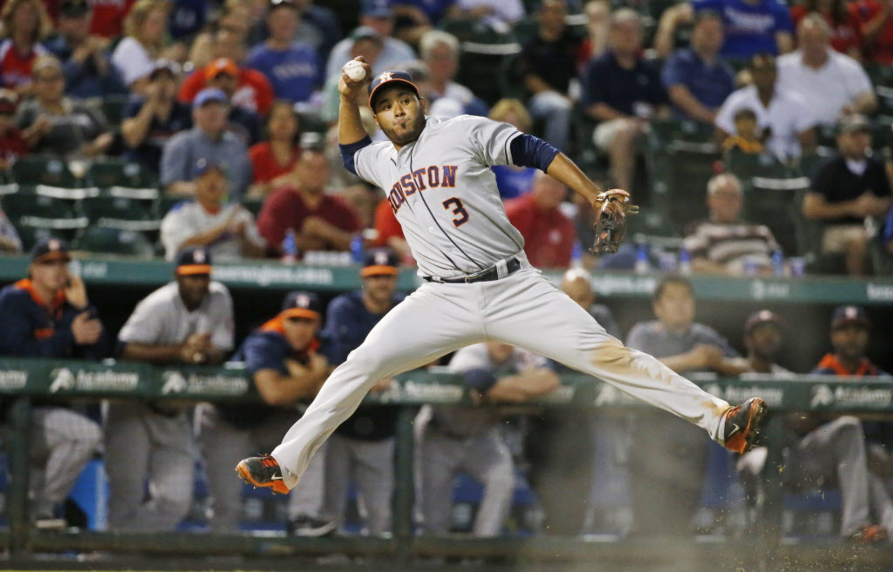 Houston third baseman Gregorio Petit (3) fields Leonys Martin's bunt but can't throw him out...