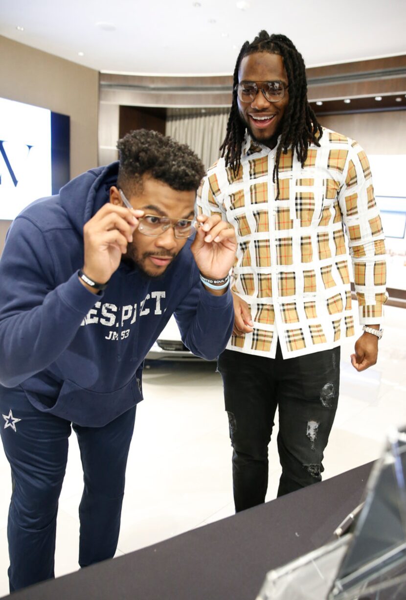 Dallas Cowboys linebacker Jaylon Smith (right) watches as his teammate Justin March-Lillard...