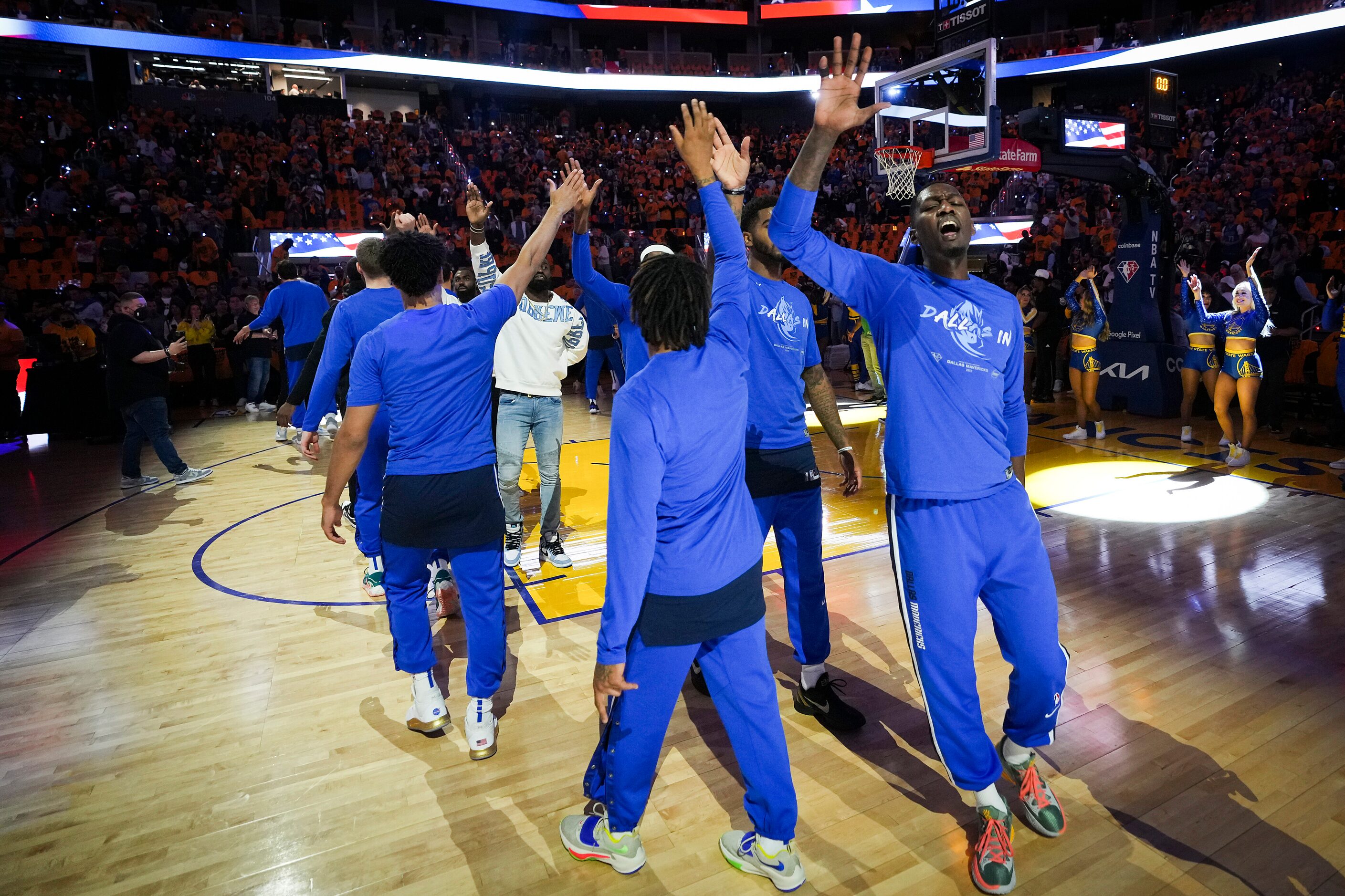 Dallas Mavericks forward Dorian Finney-Smith high fives teammates before Game 2 of the NBA...