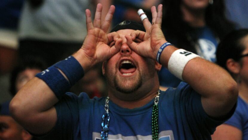 Mavs fan Thad Bouton rejoices in a Mavs three-pointer during the watch party at the American...