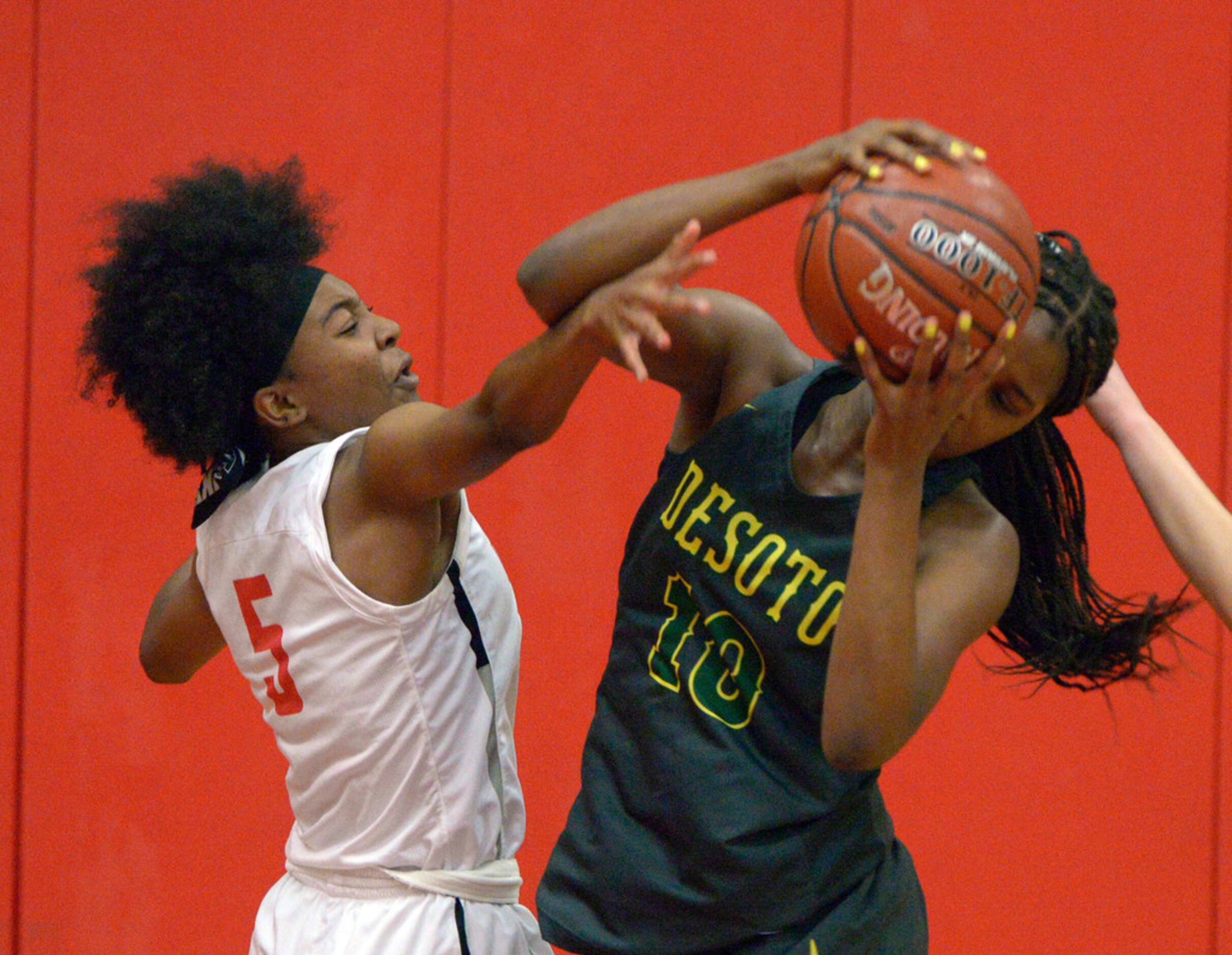 Frisco Zoe Junior (5) goes after the rebound with DeSoto's Ayanna Thompson (10) in the...