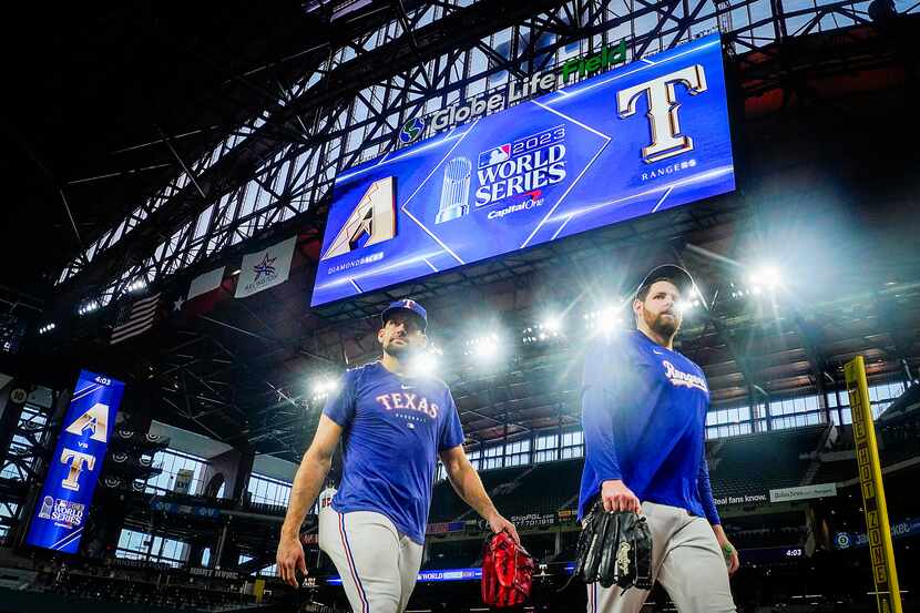 Texas Rangers starting pitchers Nathan Eovaldi (left) and Jordan Montgomery walk from the...
