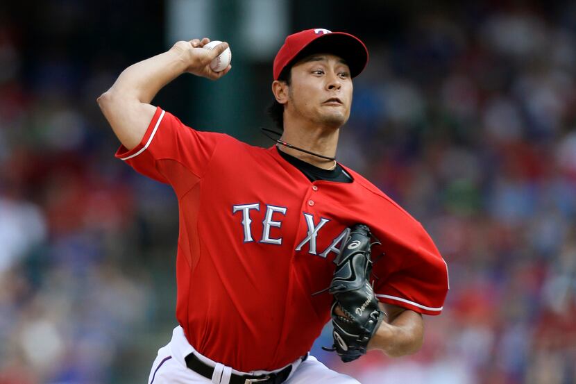 Texas Rangers starting pitcher Yu Darvish (11) of Japan works against the Houston Astros in...