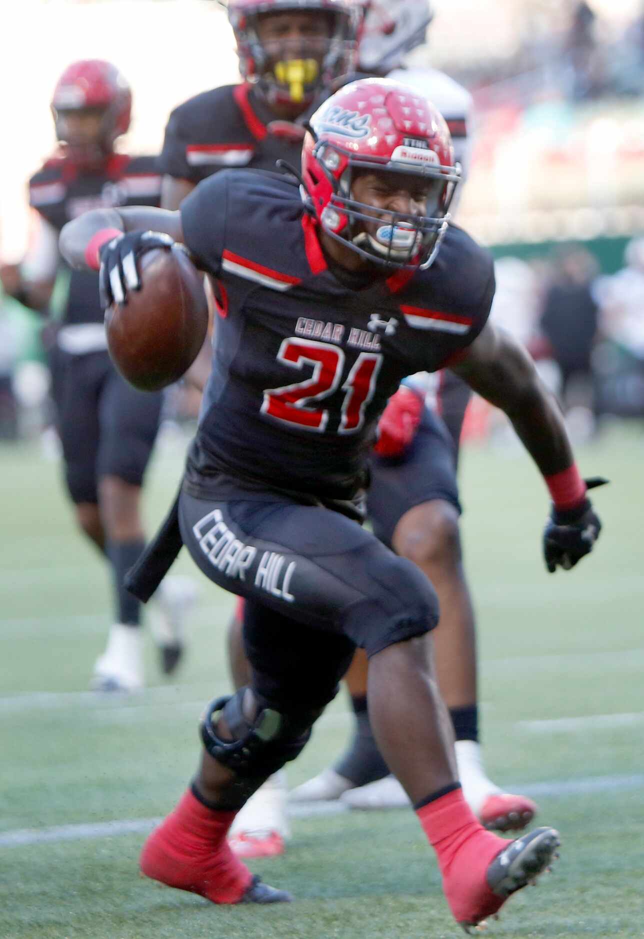 Cedar Hill running back Kris Allen (21) celebrates after scoring a game tying touchdown on a...