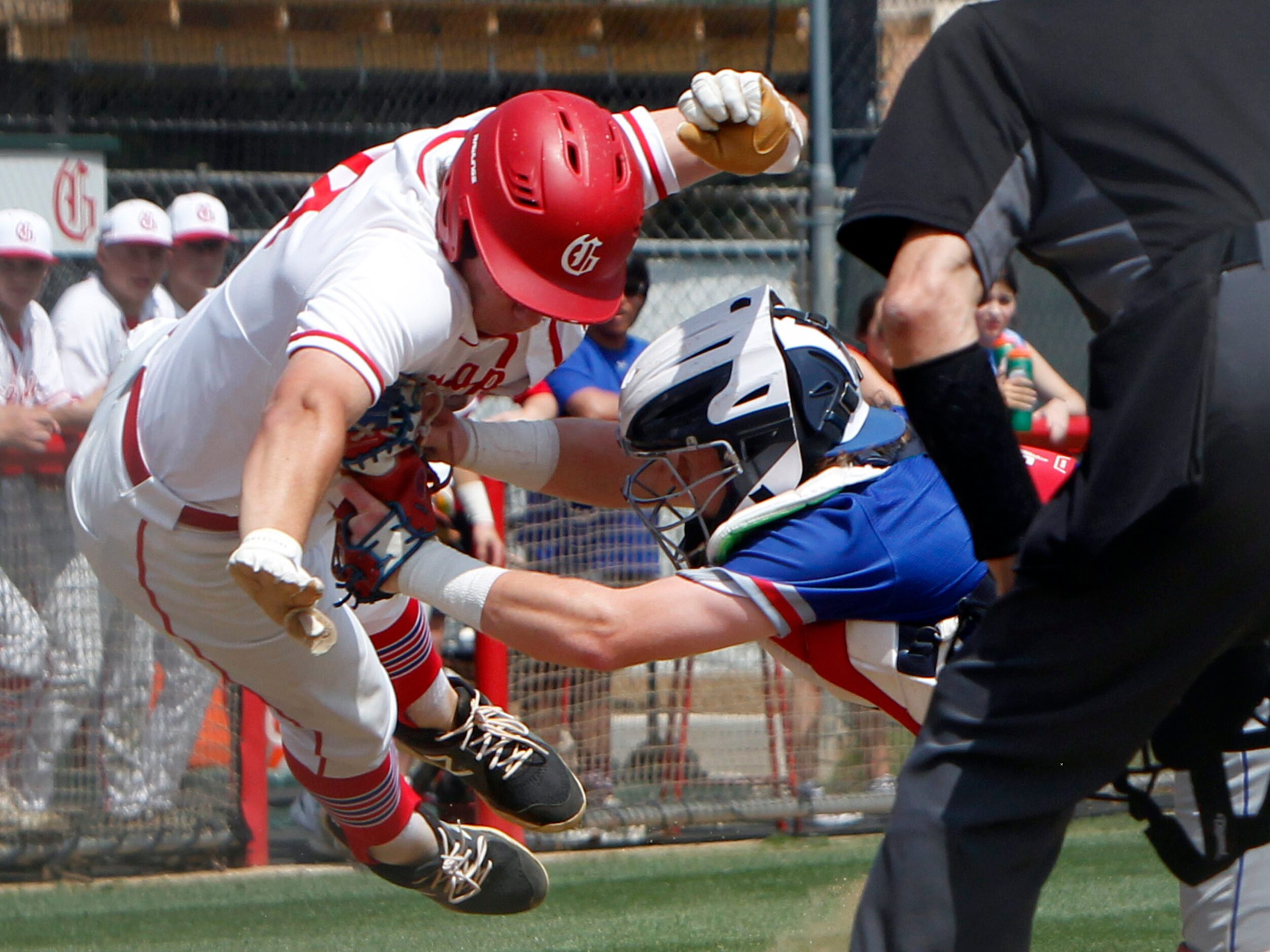 Midlothian Heritage catcher Carter Rutenbar (9), right, applies the tag to stop Grapevine's...