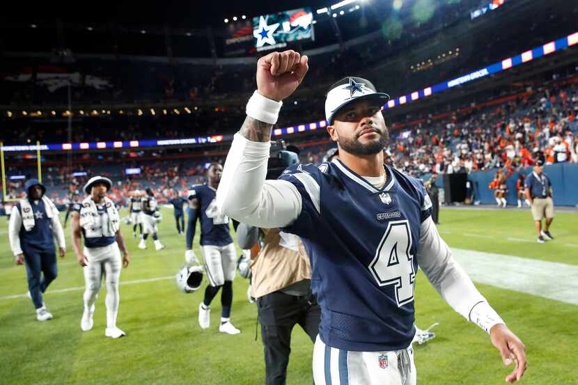 Dallas Cowboys quarterback Dak Prescott (4) acknowledges the cheers from fans as he leaves...