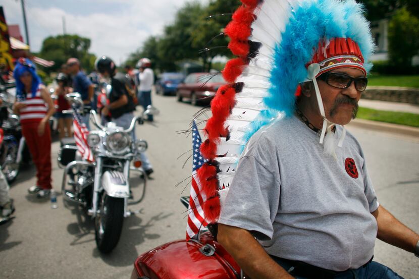 Max Koujan of the Frisco Easy Riders prepares to ride in the McKinney Fourth of July parade...