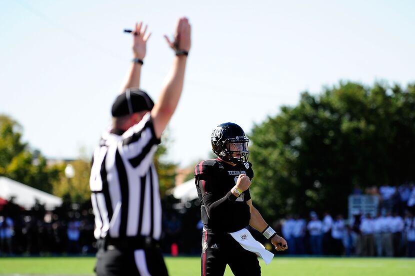 STARKVILLE, MS - NOVEMBER 03:  Johnny Manziel #2 of the Texas A&M Aggies reacts to a...