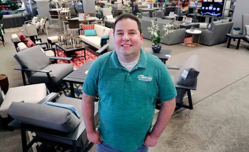 In this Tuesday, Dec. 11, 2018, photo Brad Schweig, co-owner of Sunnyland Furniture, poses...