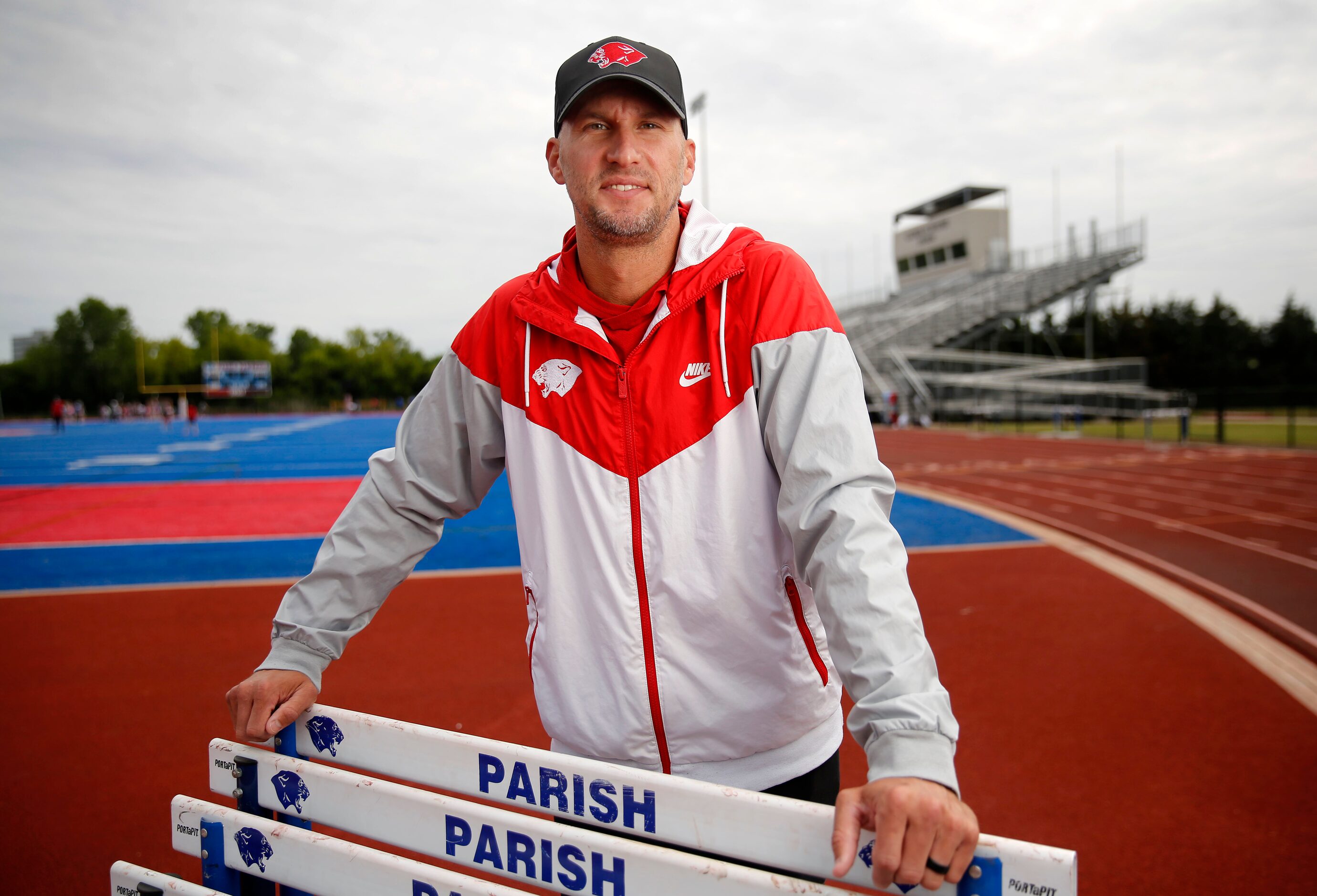 Parish Episcopal head track coach 
Jeremy Wariner poses for a photo at the schools stadium...