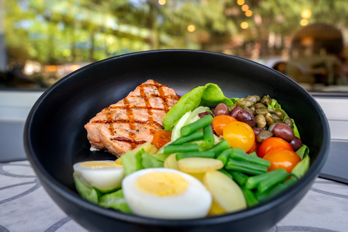 A salmon bowl, an item on the lunch menu, is shown at Sachet, a Mediterranean restaurant,...