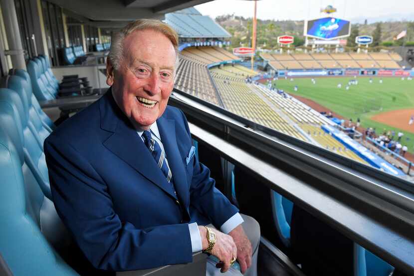 In this Sept. 20, 2016, photo, broadcaster Vin Scully is ready for a baseball game between...