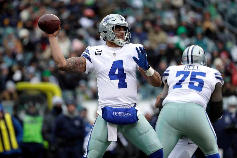 Dallas Cowboys' Dak Prescott in action during the first half of an NFL football game against...