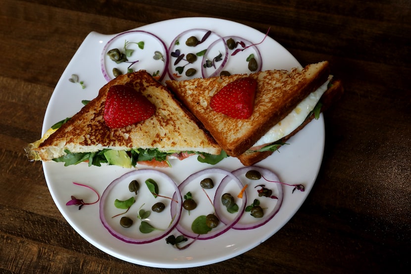 The Pink Lady Sandwich - Texas Brioche toast with smoked salmon, two fried eggs, arugula,...