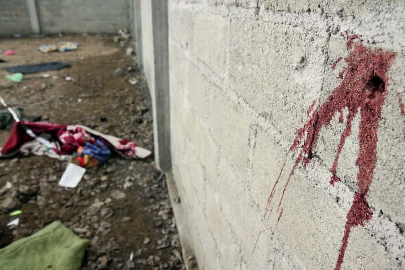 Blood is seen on the wall of a building in the Tlatlaya community after 22 people, alleged...