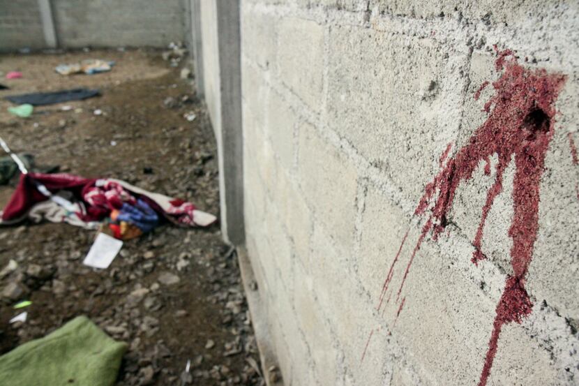 Blood is seen on the wall of a building in the Tlatlaya community after 22 people, alleged...