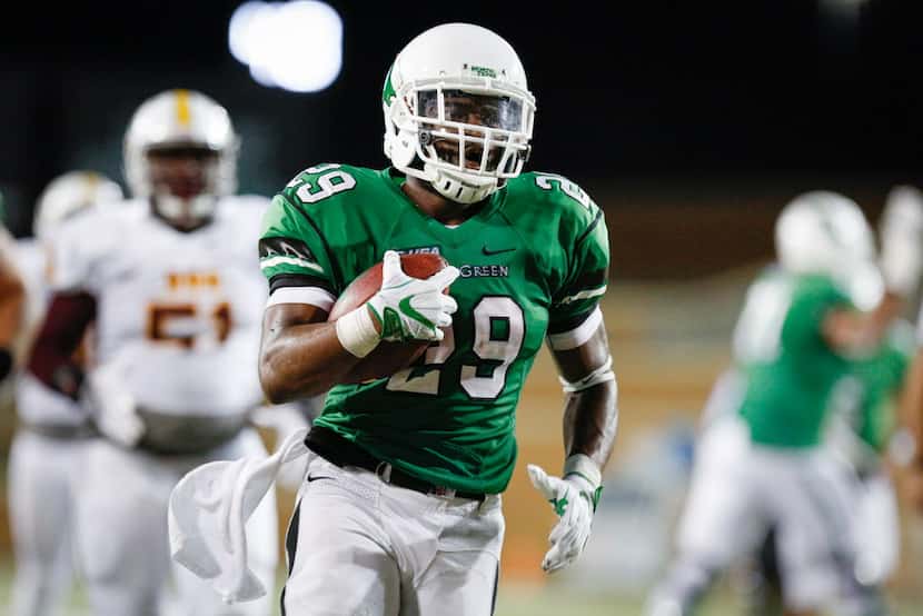 North Texas junior running back Willy Ivey (29) runs the ball against the Bethune-Cookman...