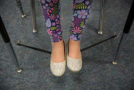 Crystal Ruiz balances her feet on a "wiggle string" attached to her desk at Davis Elementary...