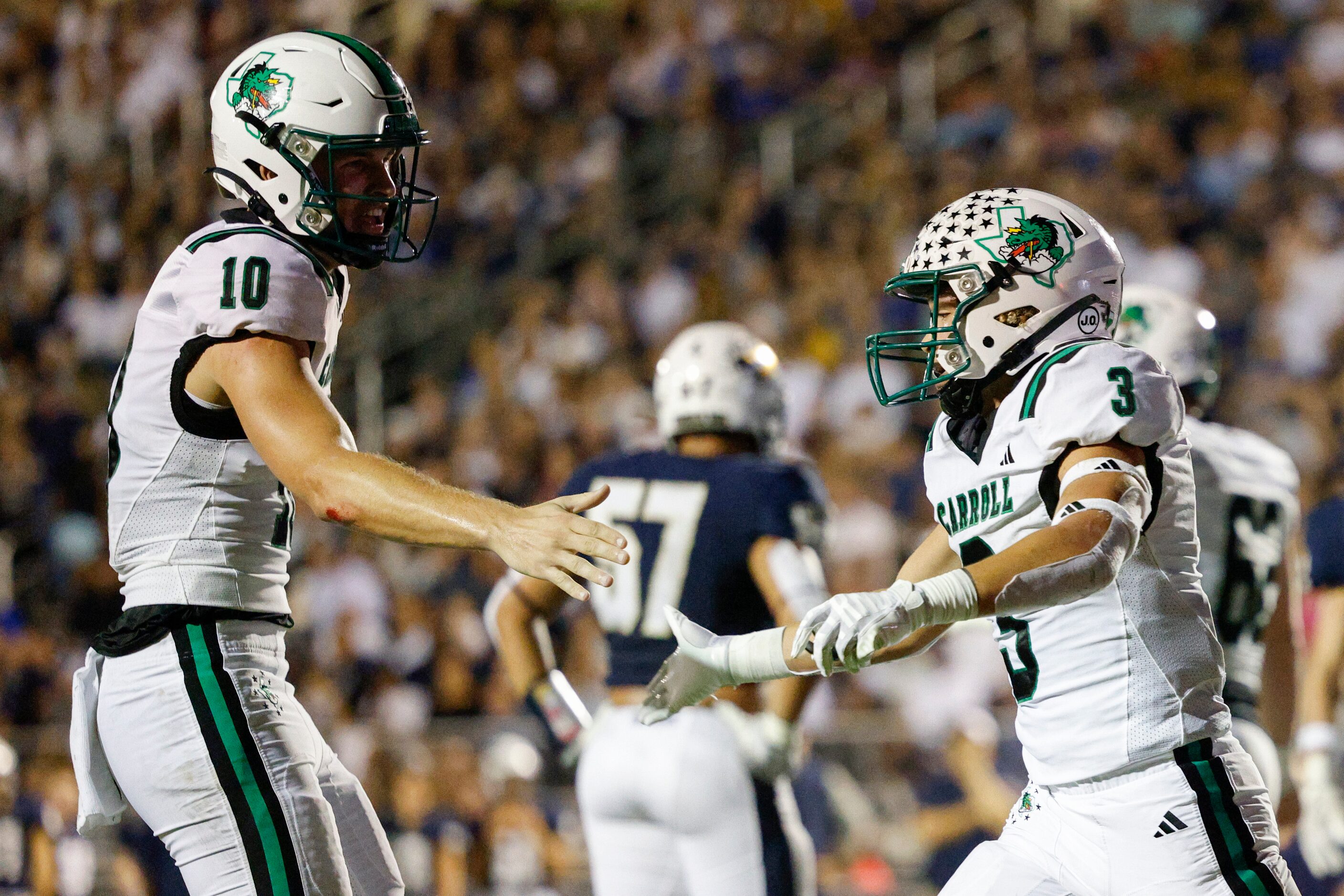 Southlake Carroll running back Davis Penn (3) celebrates his touchdown with quarterback...