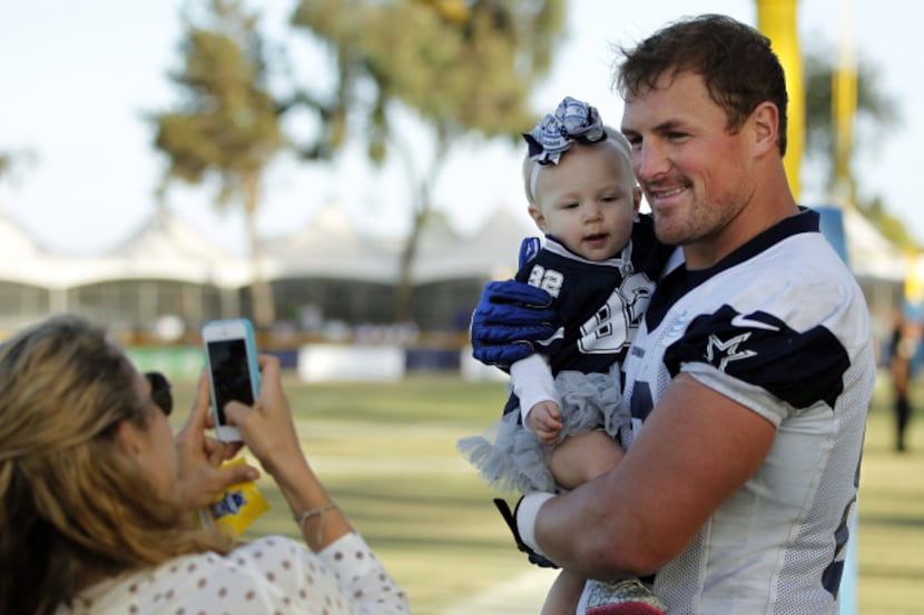 Dallas Cowboys tight end Jason Witten (82) and 10 month old daughter Landry Witten pose for...