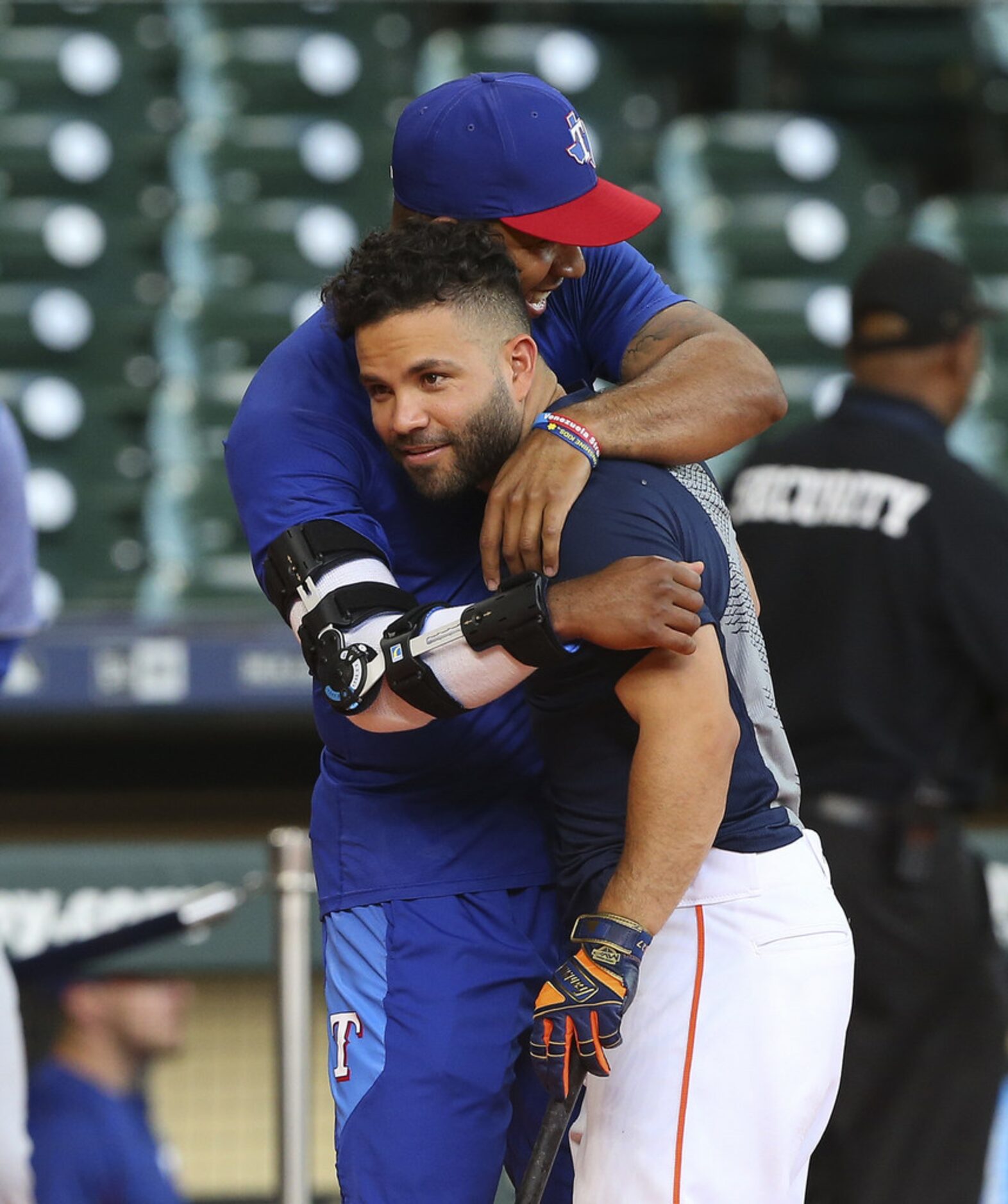 HOUSTON, TX - MAY 11:  Jose Altuve #27 of the Houston Astros receives a hug from Elvis...