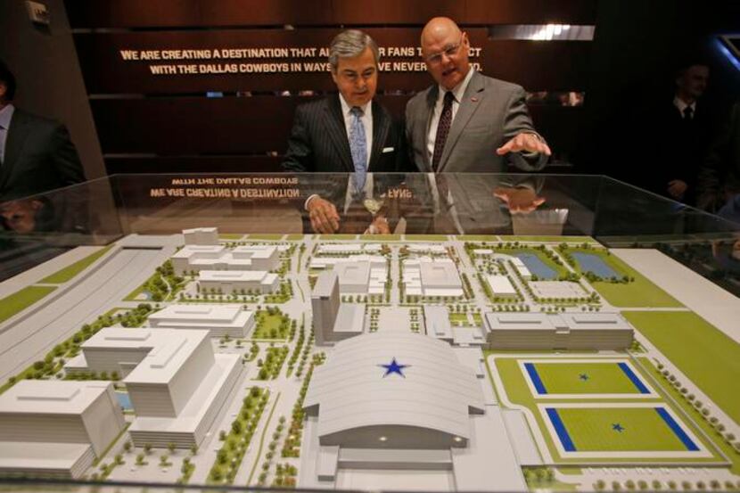 
Randy Garrett (left) and James L. Gandy went over a scale model of The Star in Frisco...