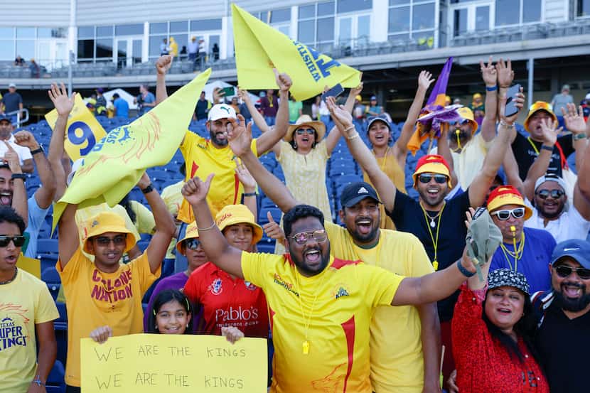 Aashna Sheth, 11, (front left) and Rajasekar Murugesan (center) including others cheer ahead...