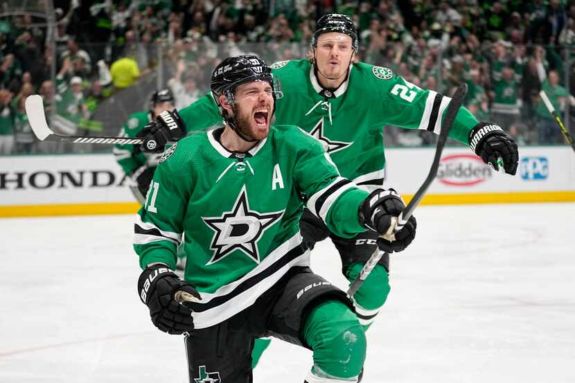 Dallas Stars center Tyler Seguin (91) and Roope Hintz (24) celebrate after Seguin scored...