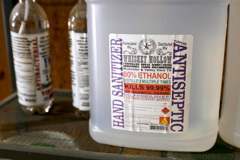 Bottles of hand sanitizer made during the pandemic sit idle on a shelf at Whiskey Hollow in...