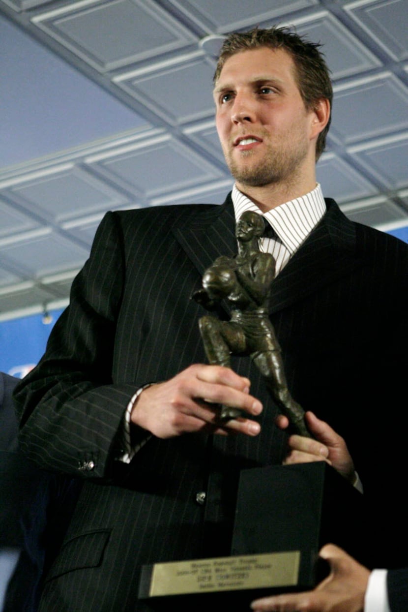  Dallas Mavericks forward Dirk Nowitzki, of Germany, poses with the Maurice Podoloff Trophy...