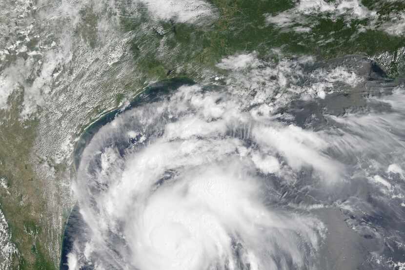 This satellite image provided by NASA on Thursday, Aug. 24, 2017 shows Hurricane Harvey off...