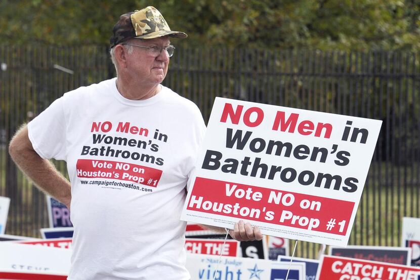 
File - In this Oct. 21, 2015 file photo, a man urges people to vote against the Houston...