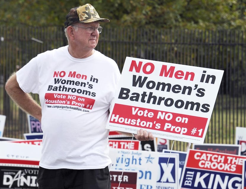 
File - In this Oct. 21, 2015 file photo, a man urges people to vote against the Houston...