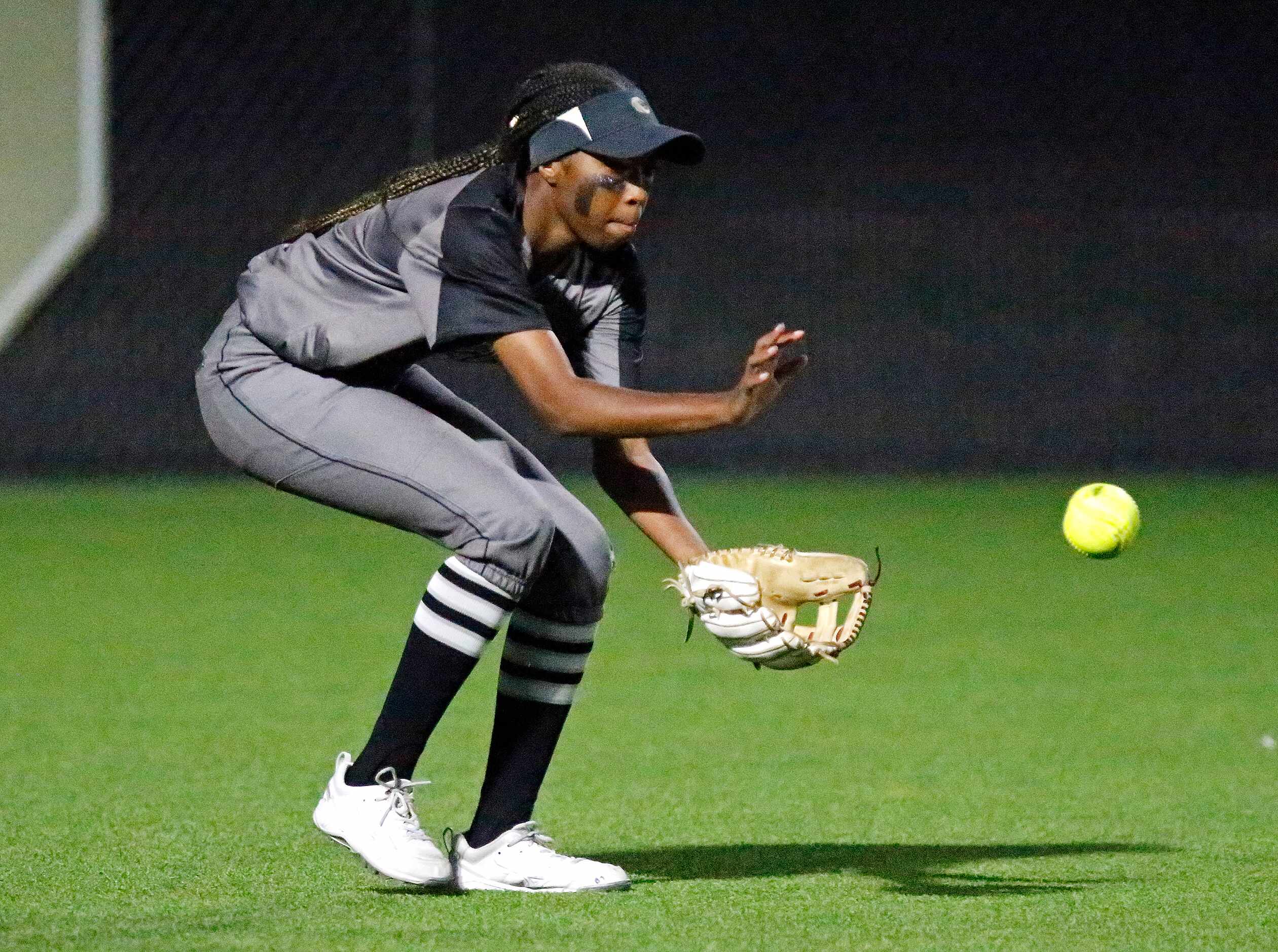 Denton Guyer High School left fielder Lauryn Jones (6) fields a base hit in the third inning...